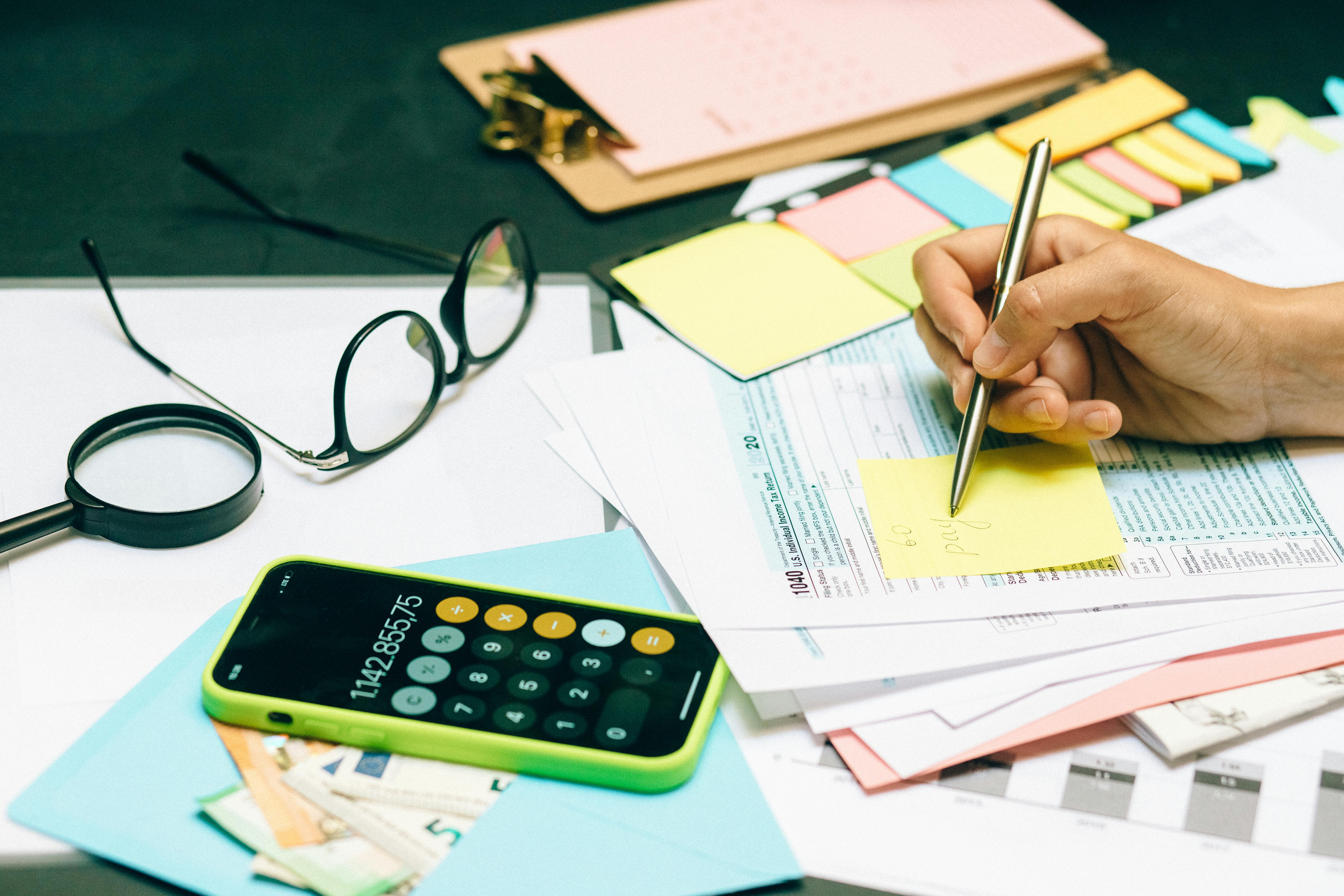 desk with papers and cellphone